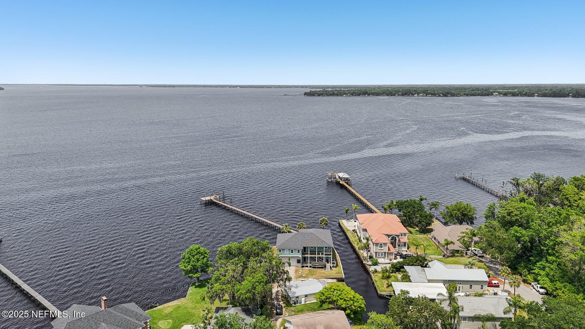 2878 Adams Road St. Augustine, FL 32092 - Photo 20 of 101 an aerial view of a house with a yard and potted plants