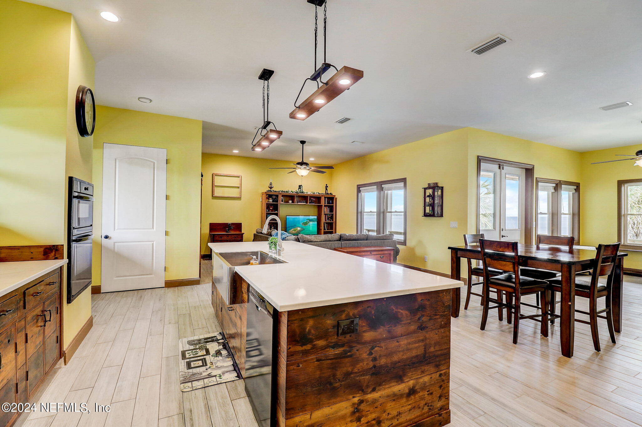 2878 Adams Road St. Augustine, FL 32092 - Photo 34 of 101 a large kitchen with a table and chairs