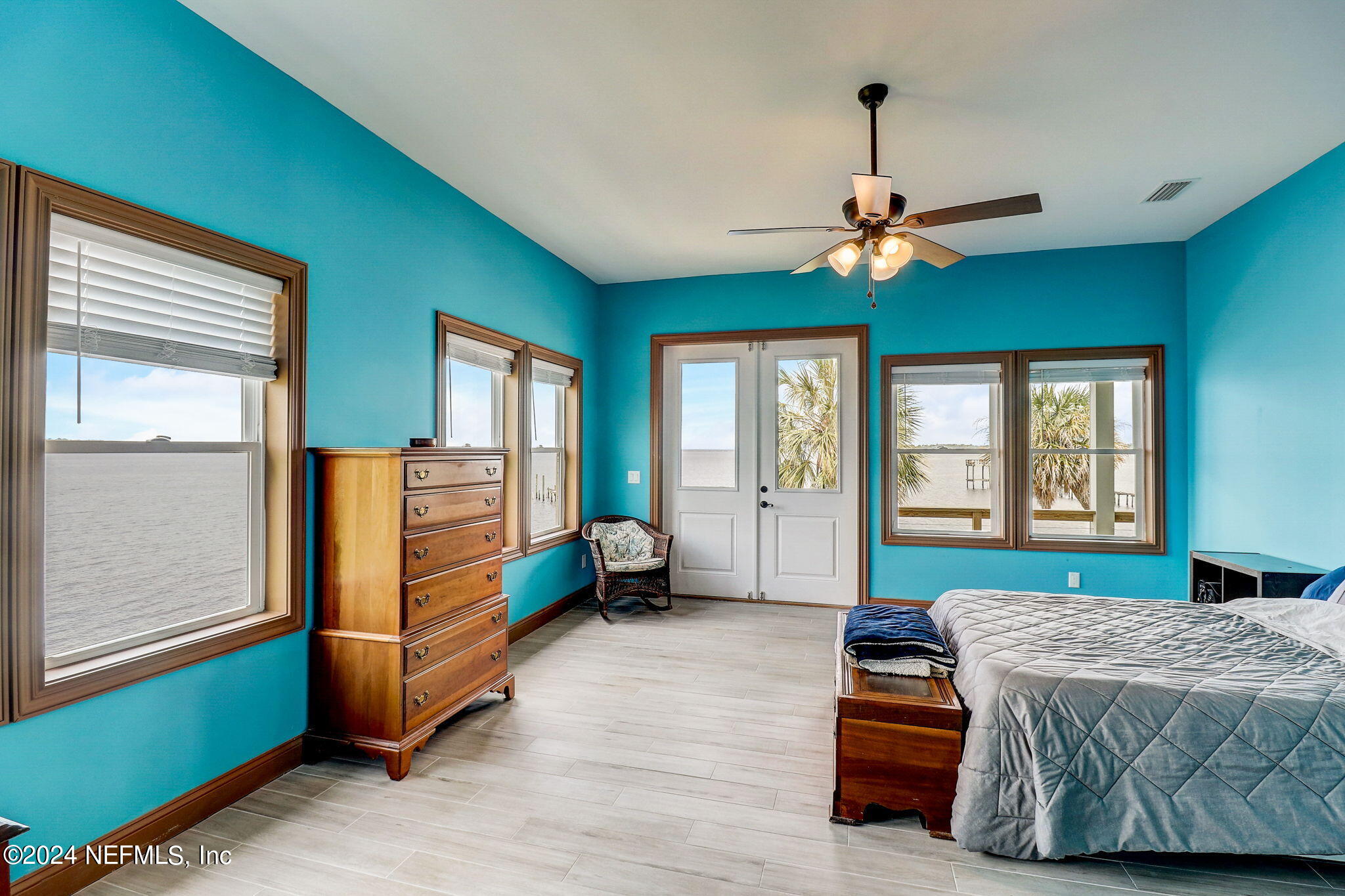 2878 Adams Road St. Augustine, FL 32092 - Photo 53 of 101 a bedroom with a bed and a chandelier