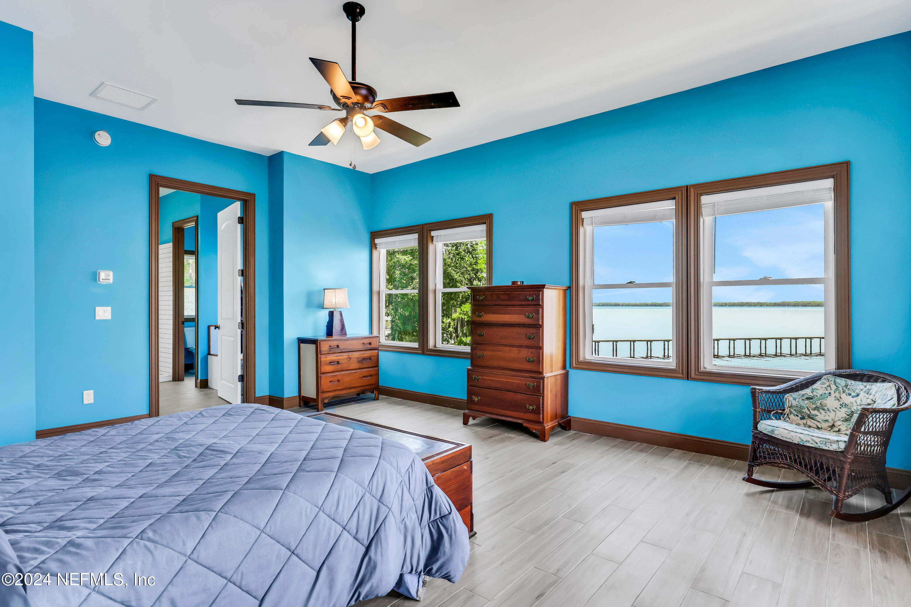 2878 Adams Road St. Augustine, FL 32092 - Photo 55 of 101 a bedroom with a bed and a chandelier