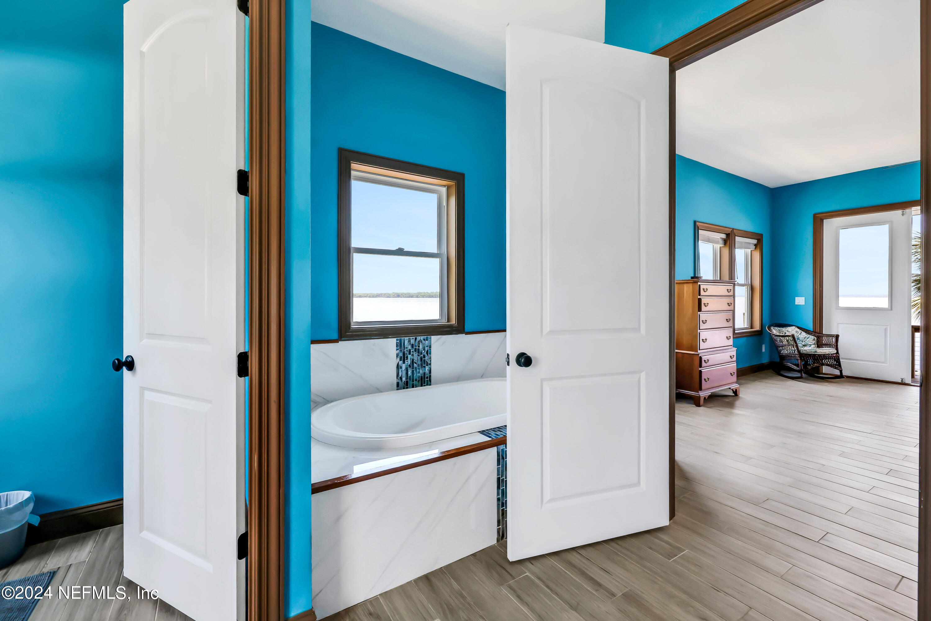 2878 Adams Road St. Augustine, FL 32092 - Photo 60 of 101 a en suite bathroom with a sink and a mirror