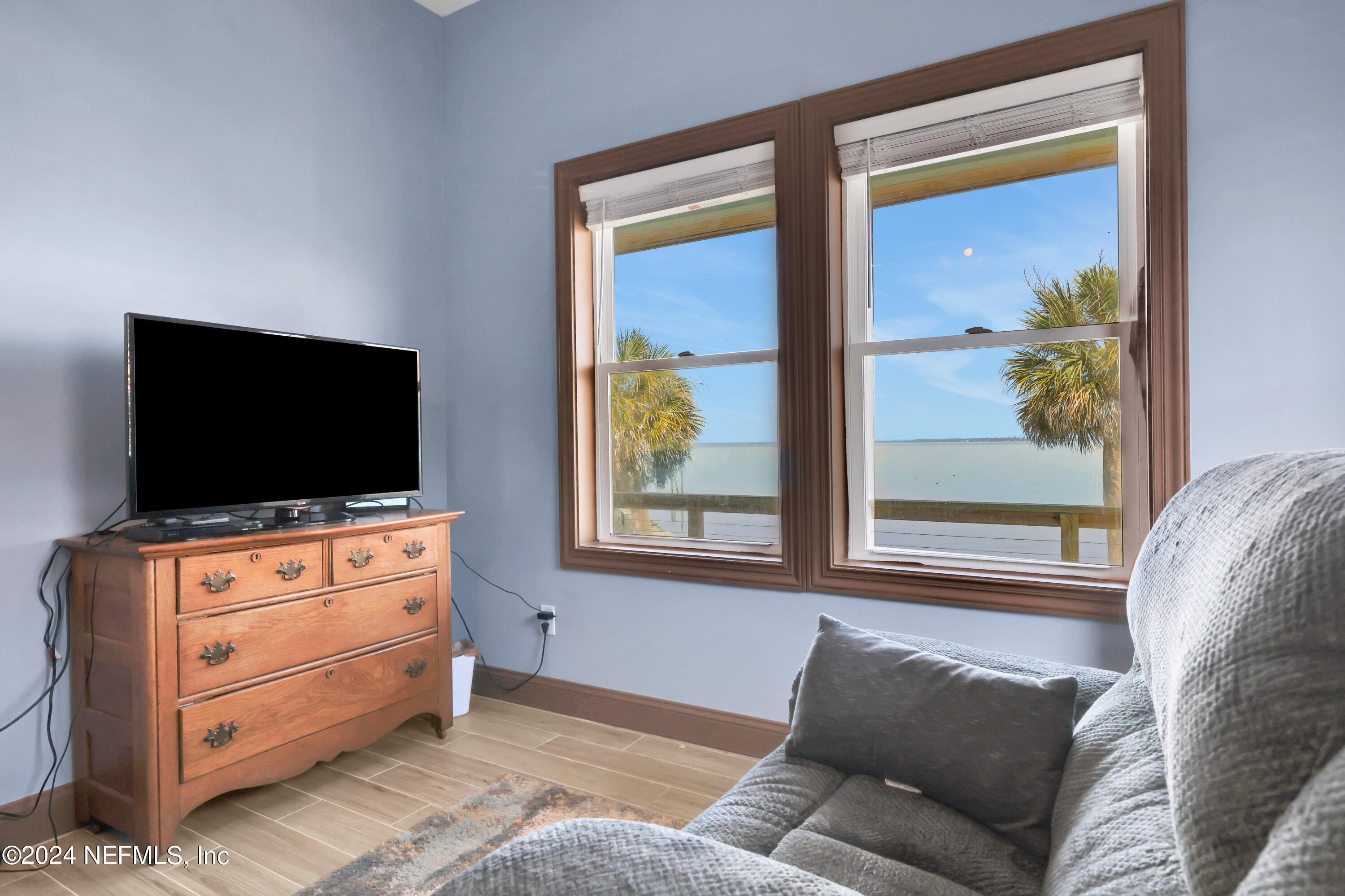 2878 Adams Road St. Augustine, FL 32092 - Photo 64 of 101 a living room with furniture and a flat screen tv