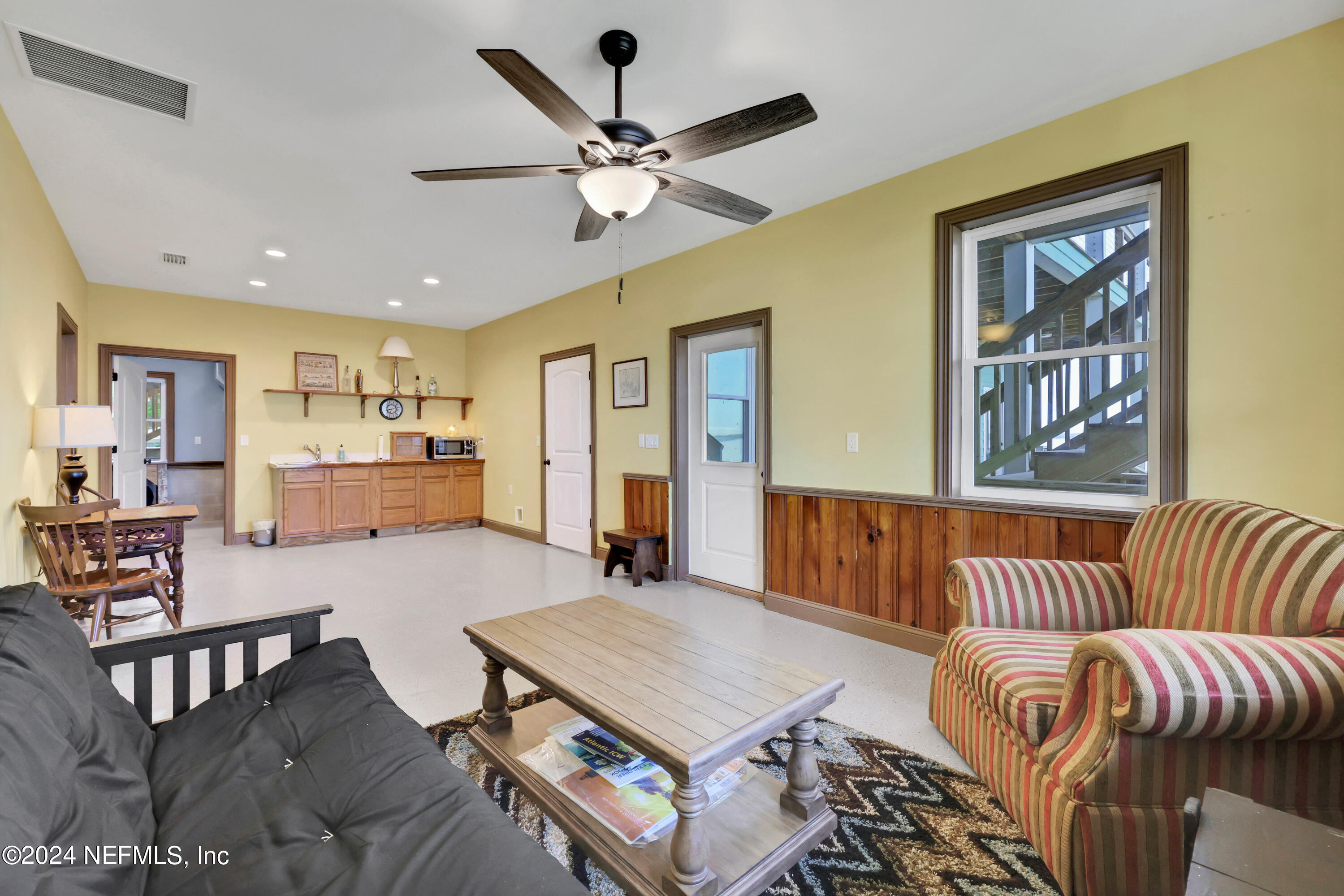 2878 Adams Road St. Augustine, FL 32092 - Photo 66 of 101 a living room with furniture and a view of bedroom