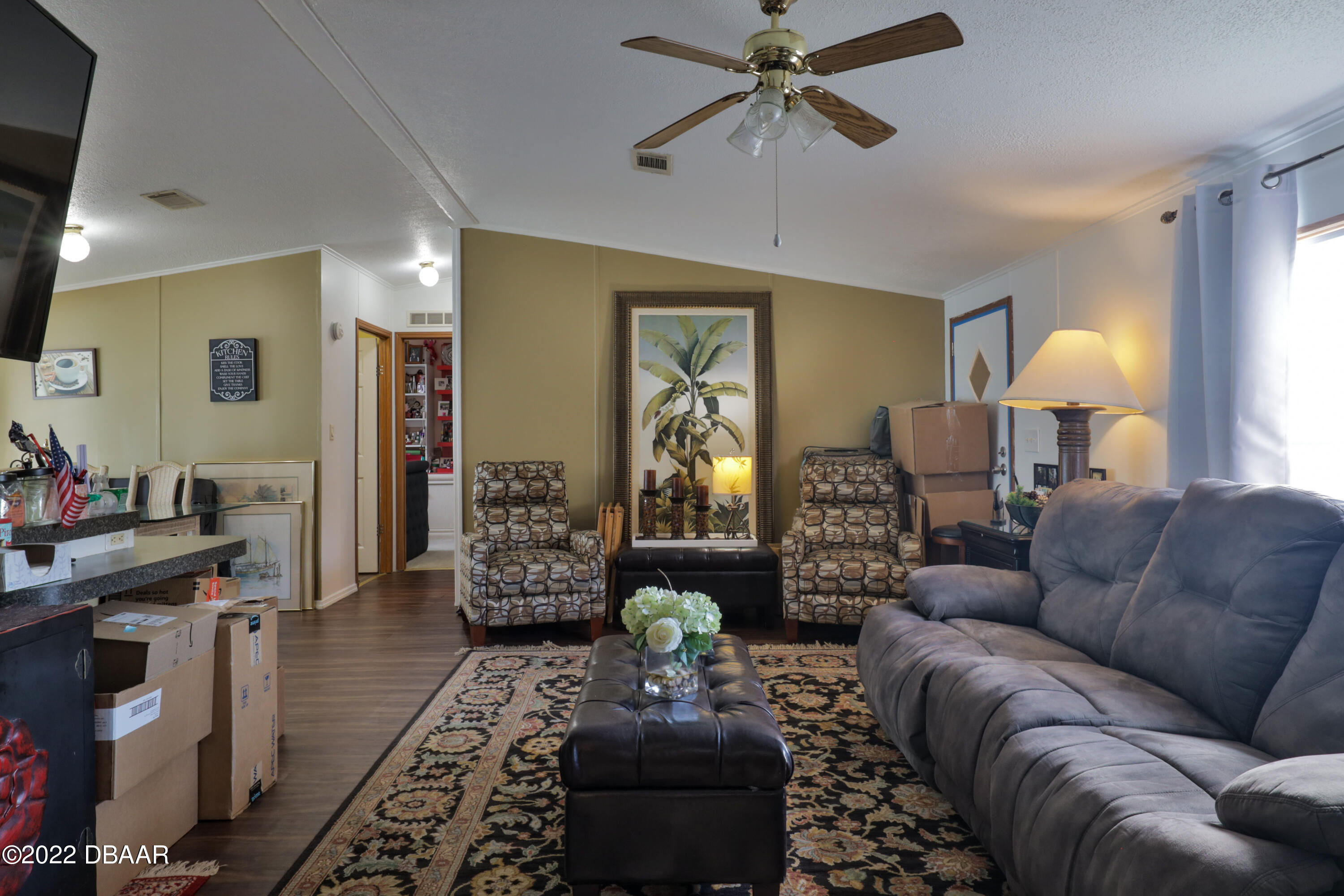 175 Coleman Street Edgewater, FL 32141 - Photo 12 of 32 a living room with furniture and a chandelier