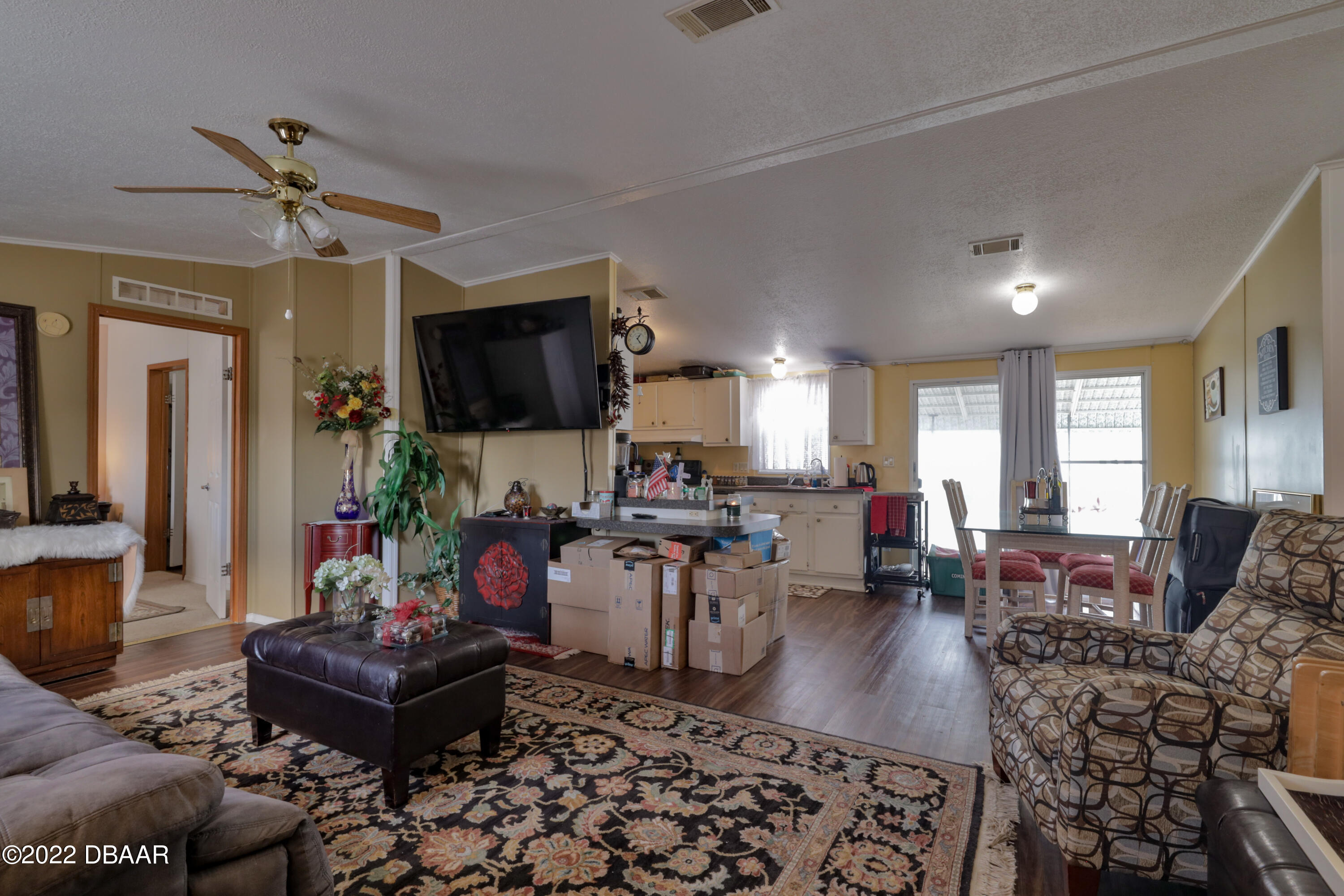 175 Coleman Street Edgewater, FL 32141 - Photo 13 of 32 a living room with furniture a flat screen tv and a window
