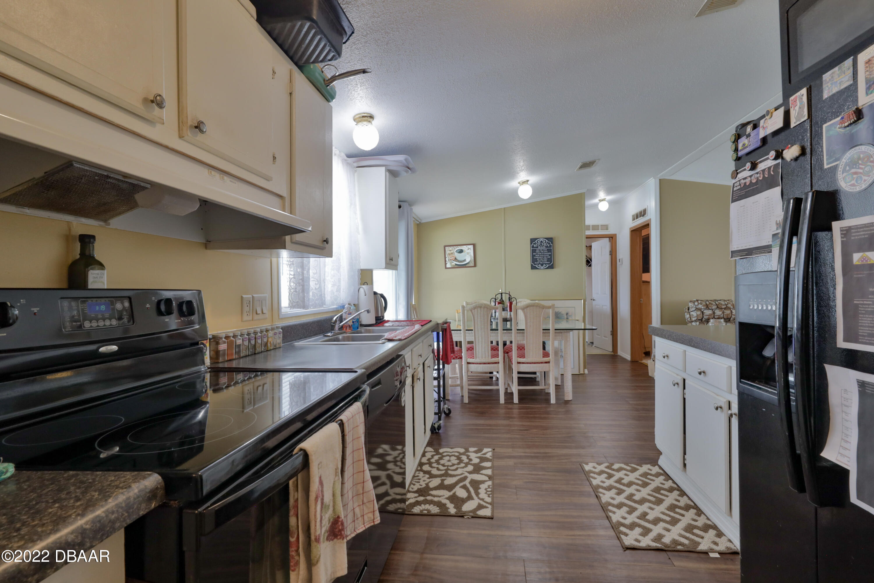 175 Coleman Street Edgewater, FL 32141 - Photo 16 of 32 a kitchen with lots of counter top space and stainless steel appliances