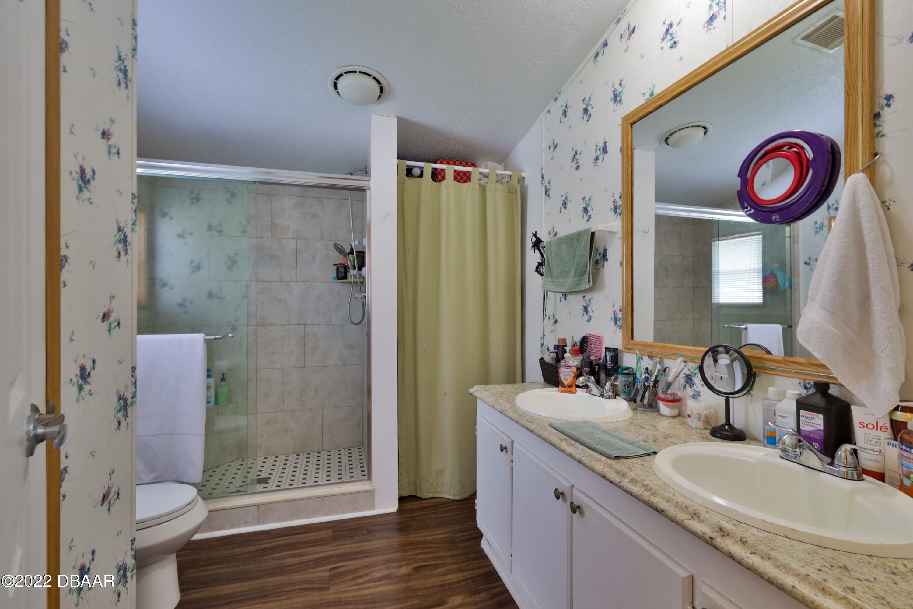 175 Coleman Street Edgewater, FL 32141 - Photo 22 of 32 a bathroom with a granite countertop sink toilet and shower