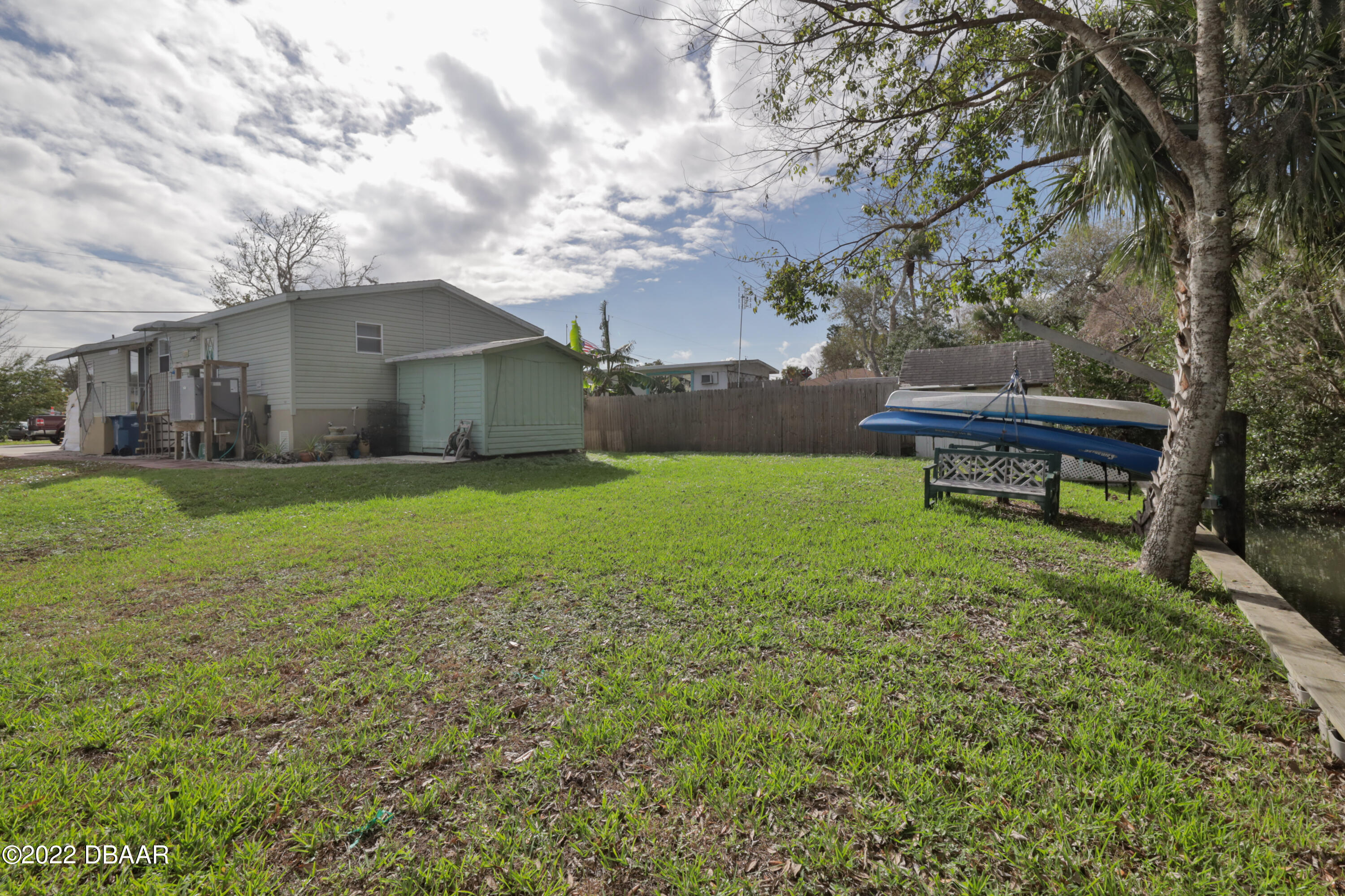 175 Coleman Street Edgewater, FL 32141 - Photo 7 of 32 a backyard of a house with table and chairs