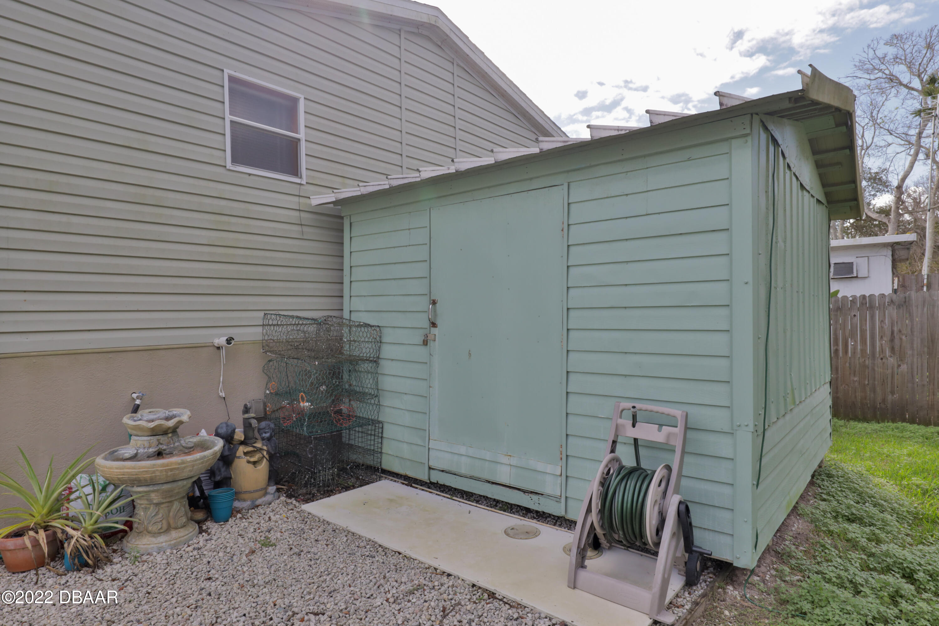 175 Coleman Street Edgewater, FL 32141 - Photo 9 of 32 a backyard of a house with outdoor seating