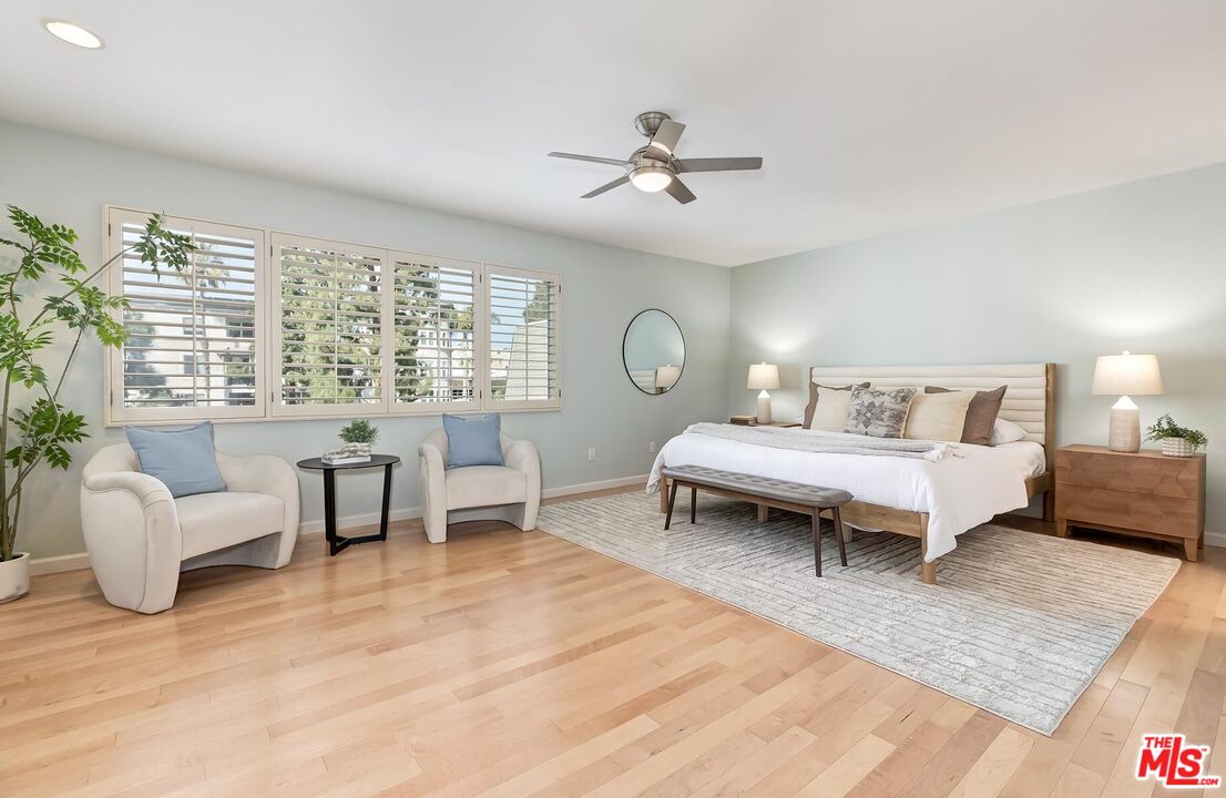 13336 Maxella Avenue, Unit 5 Marina del Rey, CA 90292 - Photo 12 of 26 a bedroom with furniture and a large window