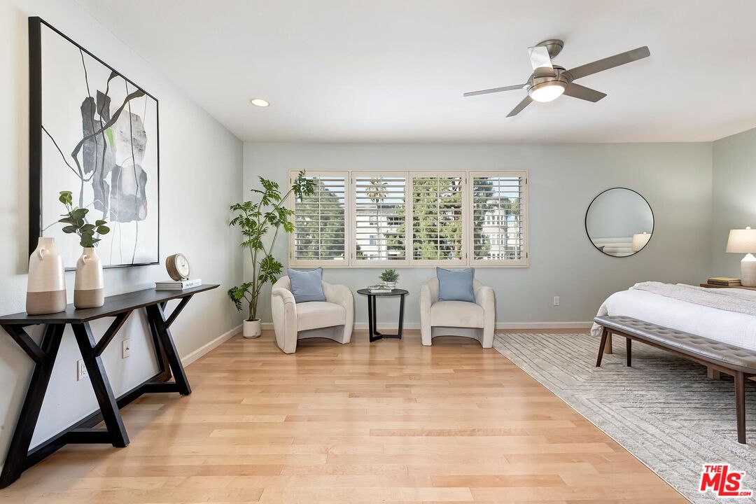 13336 Maxella Avenue, Unit 5 Marina del Rey, CA 90292 - Photo 13 of 26 a living room with furniture and a large window