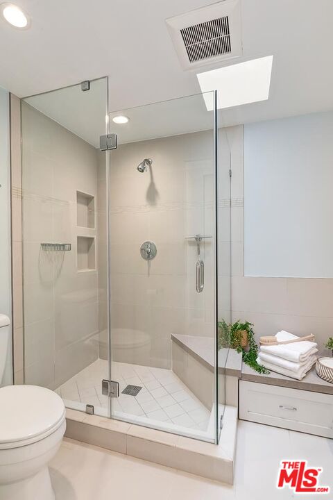13336 Maxella Avenue, Unit 5 Marina del Rey, CA 90292 - Photo 16 of 26 a bathroom with a shower and a toilet