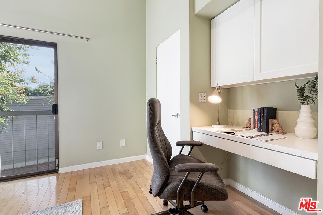 13336 Maxella Avenue, Unit 5 Marina del Rey, CA 90292 - Photo 20 of 26 a workspace with furniture and wooden floor
