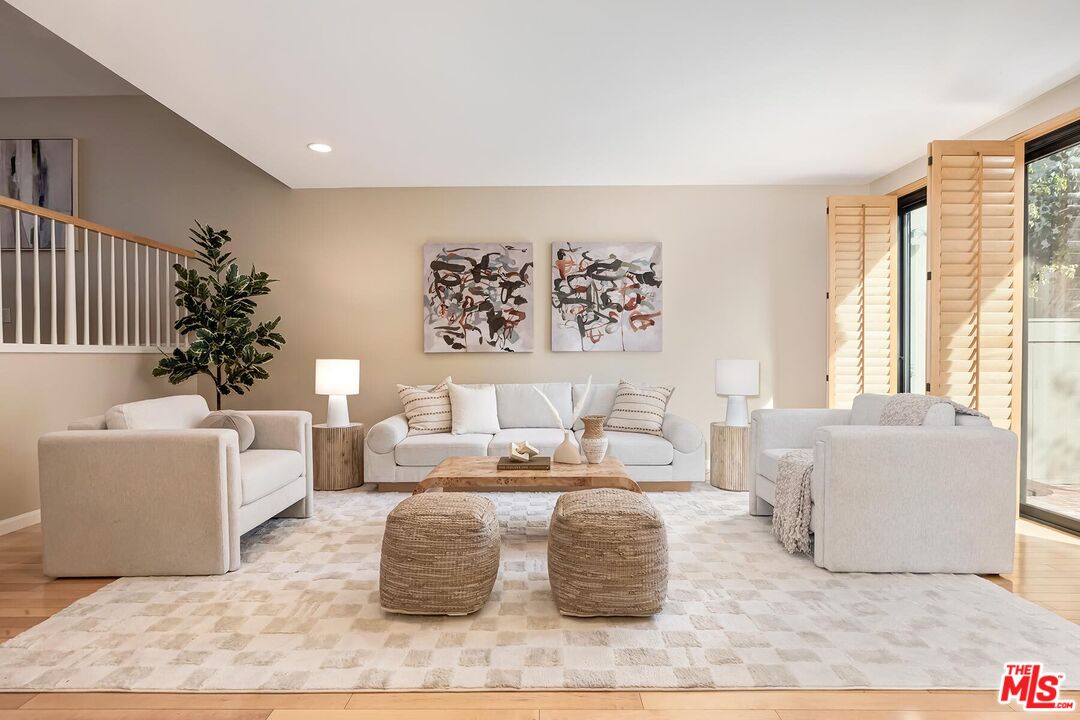 13336 Maxella Avenue, Unit 5 Marina del Rey, CA 90292 - Photo 2 of 26 a living room with furniture and a large window