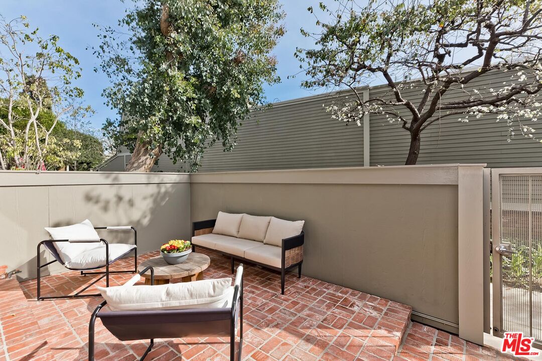 13336 Maxella Avenue, Unit 5 Marina del Rey, CA 90292 - Photo 23 of 26 a roof deck with table and chairs and potted plants