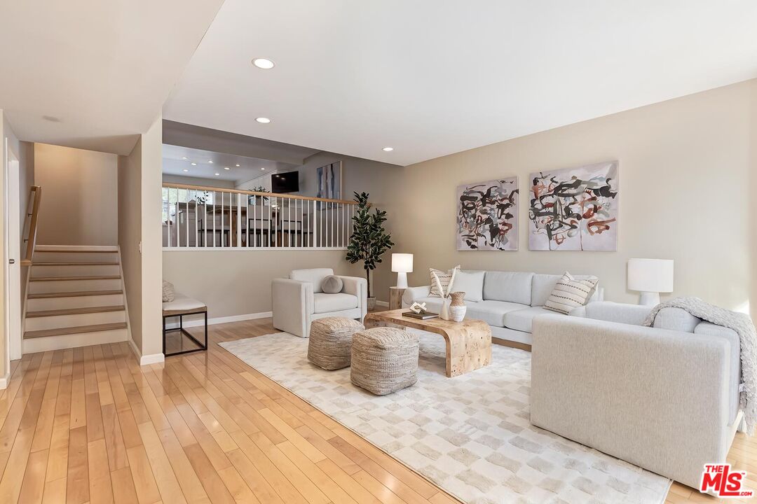 13336 Maxella Avenue, Unit 5 Marina del Rey, CA 90292 - Photo 3 of 26 a living room with furniture and a wooden floor