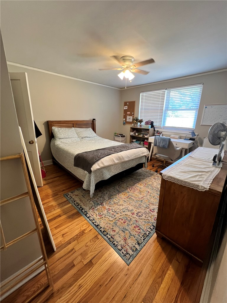 101 Clinton Drive, Unit B Anderson, SC 29621 - Photo 10 of 18 This inviting bedroom features rich hardwood flooring and abundant natural light, perfect for relaxation.