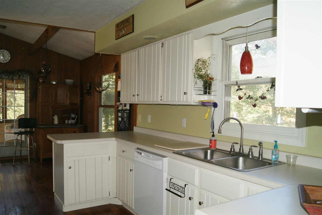 14476 Russellville Road Capron, IL 61012 - Photo 11 of 25 a kitchen with stainless steel appliances granite countertop a sink and cabinets