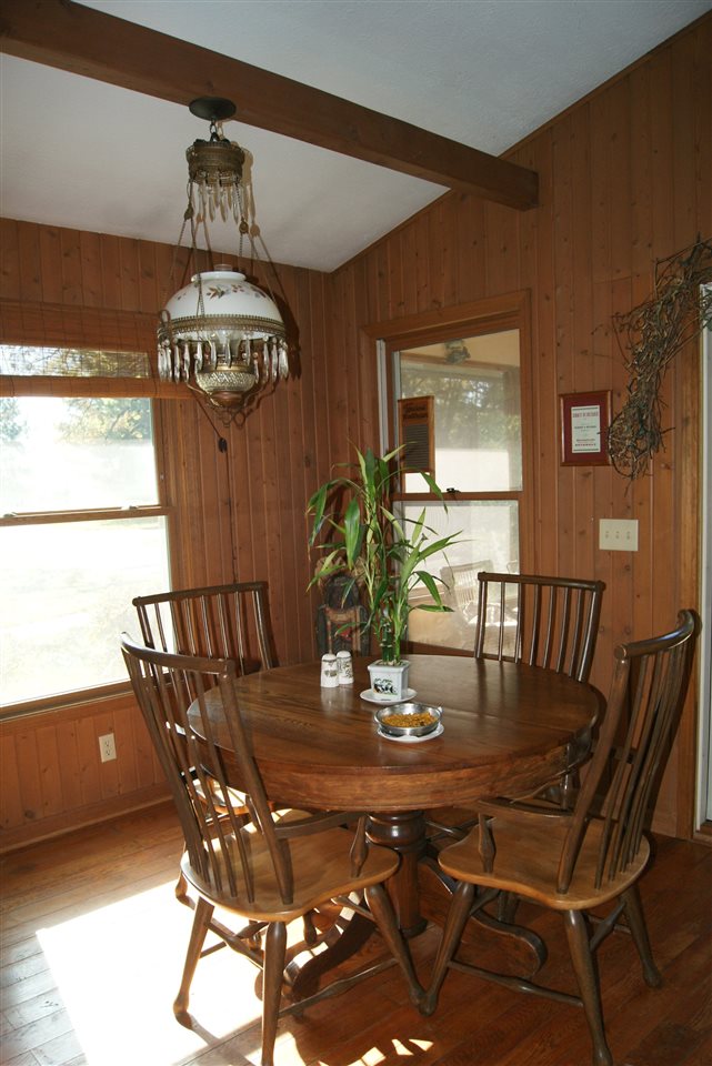 14476 Russellville Road Capron, IL 61012 - Photo 13 of 25 a view of a dining room with furniture and chandelier
