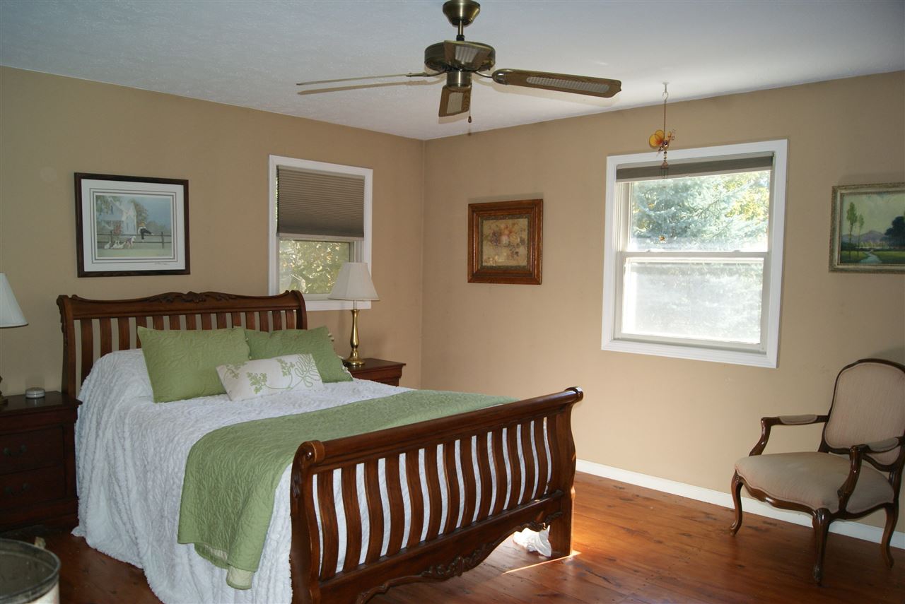 14476 Russellville Road Capron, IL 61012 - Photo 17 of 25 a bedroom with a bed and window
