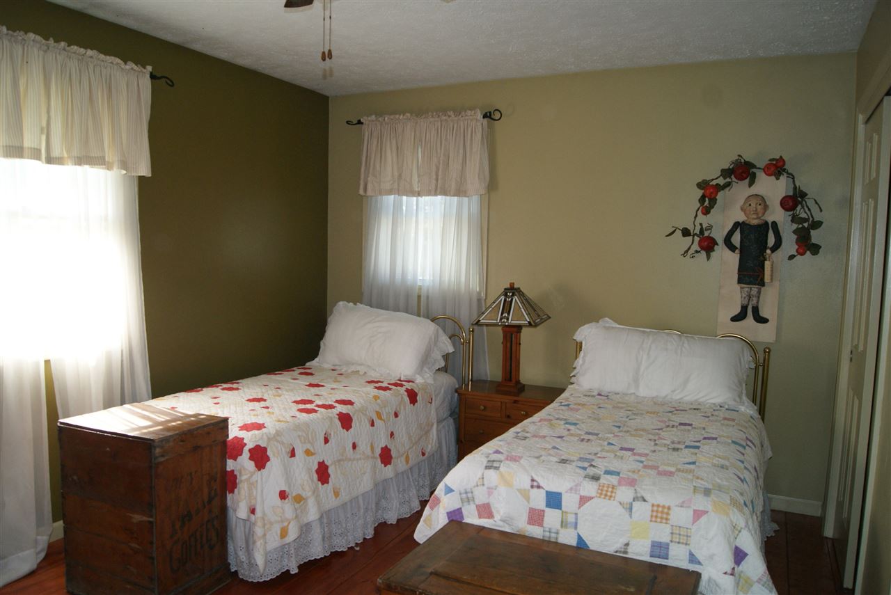 14476 Russellville Road Capron, IL 61012 - Photo 18 of 25 a bedroom with two beds and a window