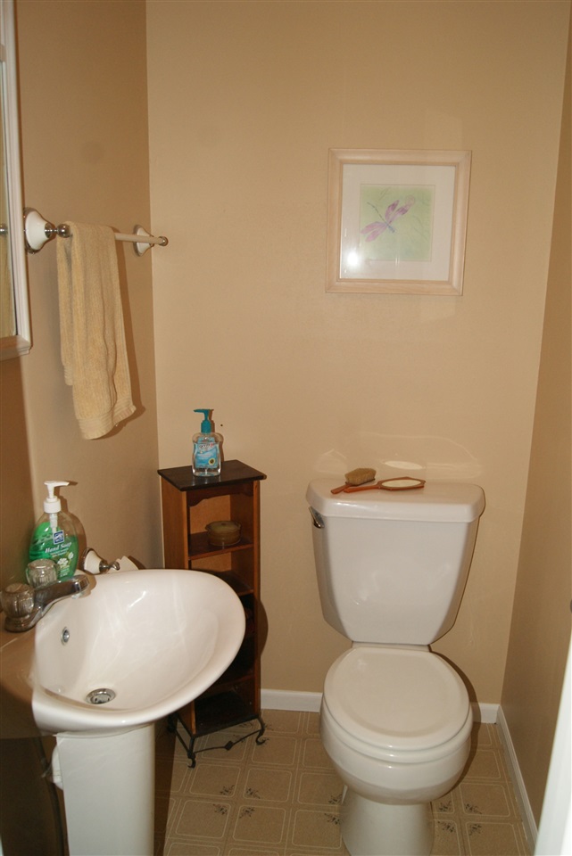 14476 Russellville Road Capron, IL 61012 - Photo 20 of 25 a bathroom with a toilet sink and a mirror