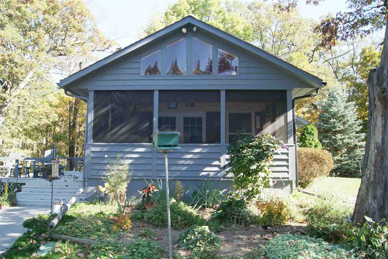 14476 Russellville Road Capron, IL 61012 - Photo 3 of 25 a front view of a house with garden