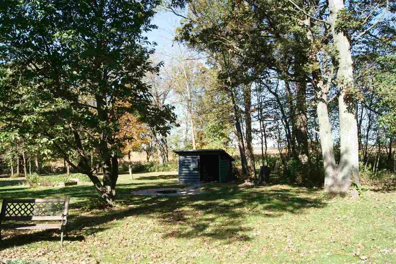 14476 Russellville Road Capron, IL 61012 - Photo 5 of 25 a view of a yard with plants and trees