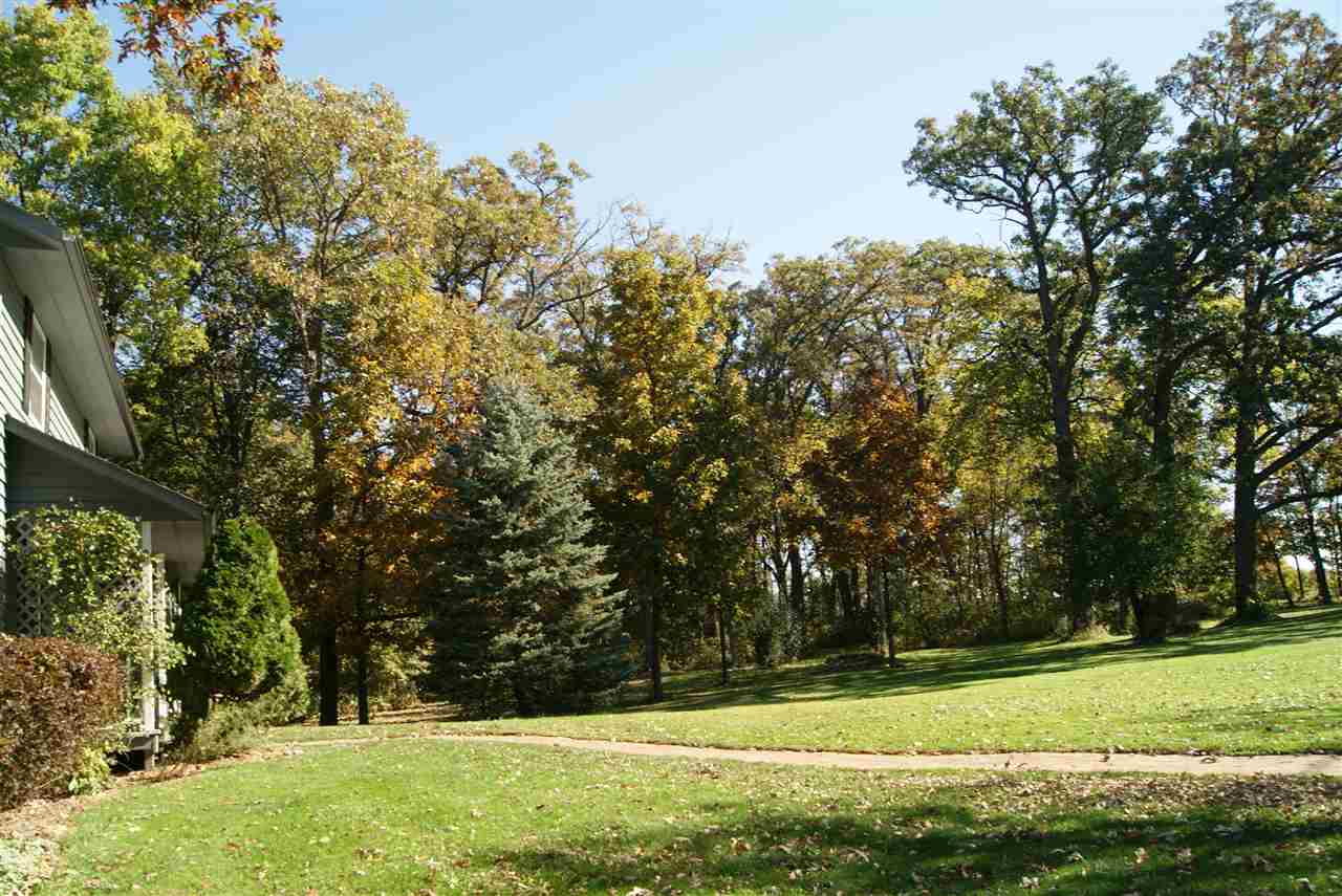 14476 Russellville Road Capron, IL 61012 - Photo 6 of 25 a view of a field with trees