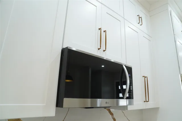 a close view of fireplace with wooden frame