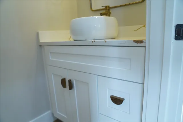 a view of empty room with wooden floor and window