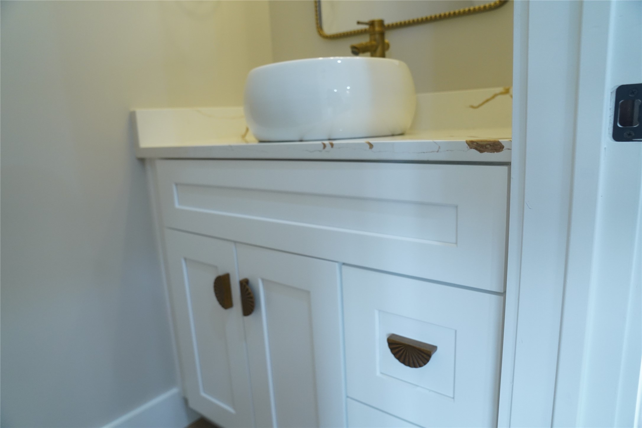 5947 Collingsworth Street Houston, TX 77026 - Photo 18 of 39 Bowl sink for half bath matching quartz and gold fixtures.