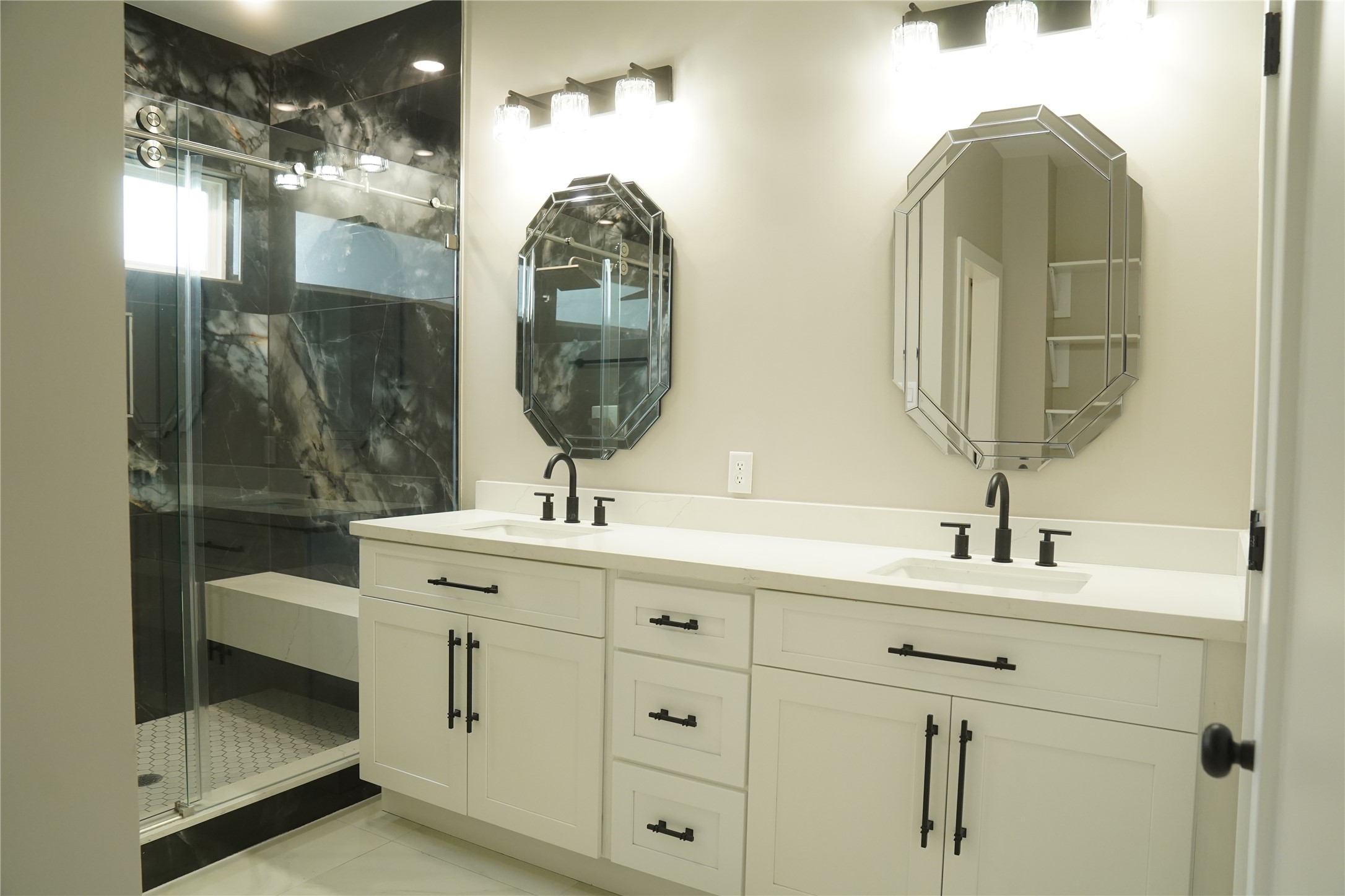 5947 Collingsworth Street Houston, TX 77026 - Photo 25 of 39 a bathroom with a double vanity sink and a mirror