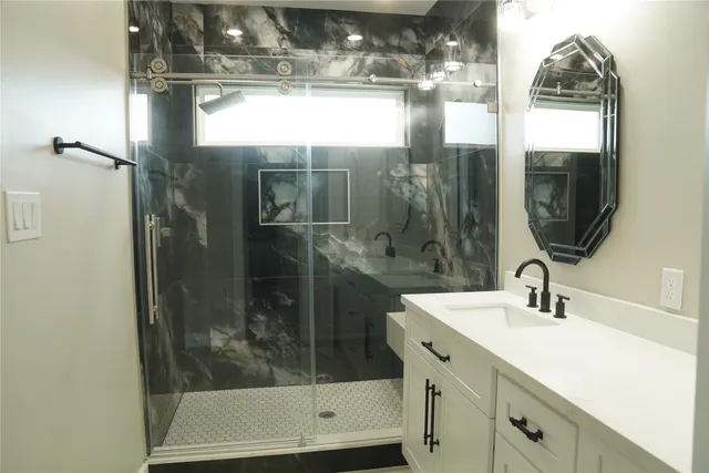 a bathroom with a sink and a mirror