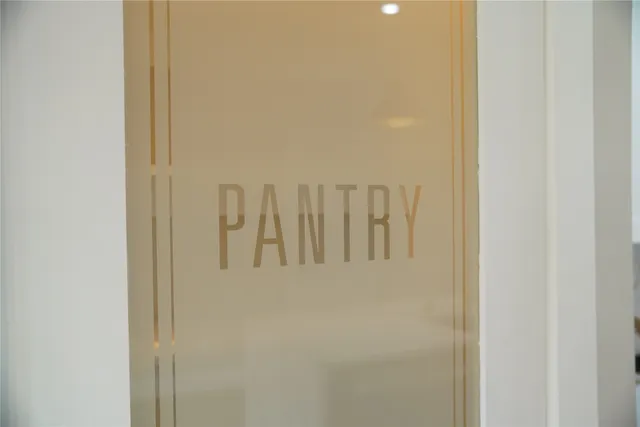 a kitchen with stainless steel appliances kitchen island granite countertop a stove a refrigerator and a microwave