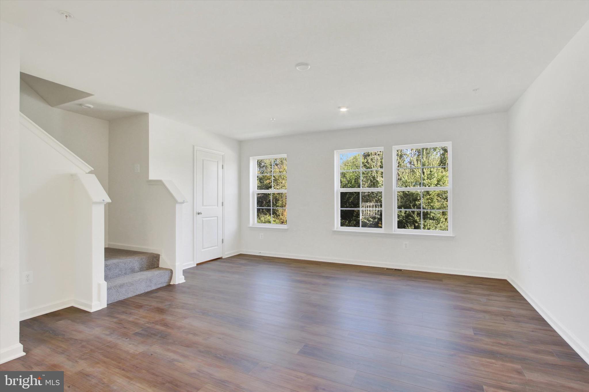 107 Homestead Drive Hanover, PA 17331 - Photo 17 of 34 an empty room with wooden floor and windows
