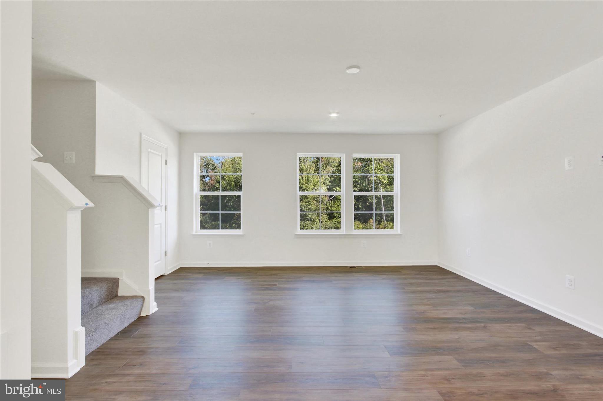 107 Homestead Drive Hanover, PA 17331 - Photo 20 of 34 an empty room with wooden floor and windows