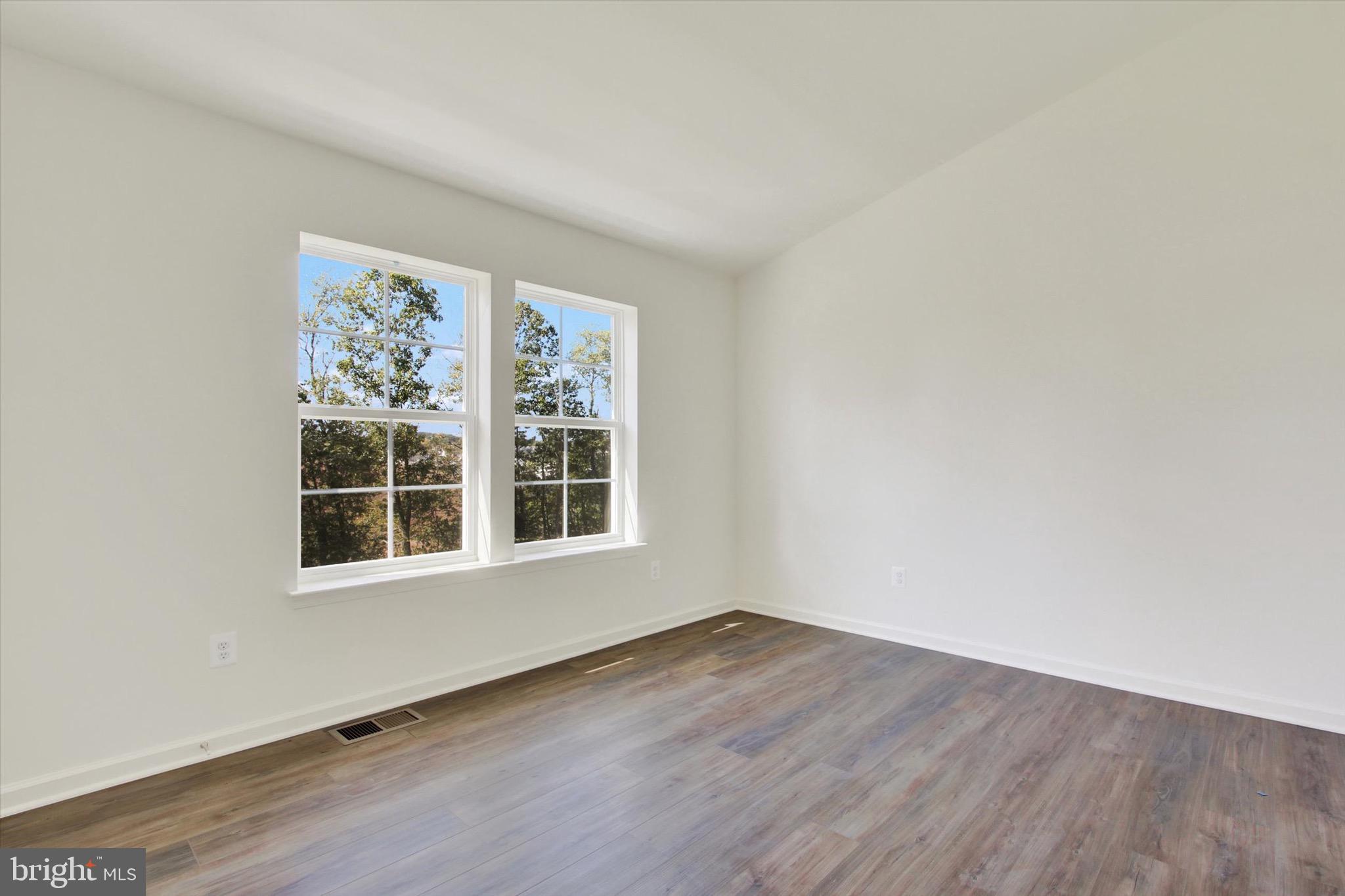 107 Homestead Drive Hanover, PA 17331 - Photo 22 of 34 an empty room with wooden floor and windows