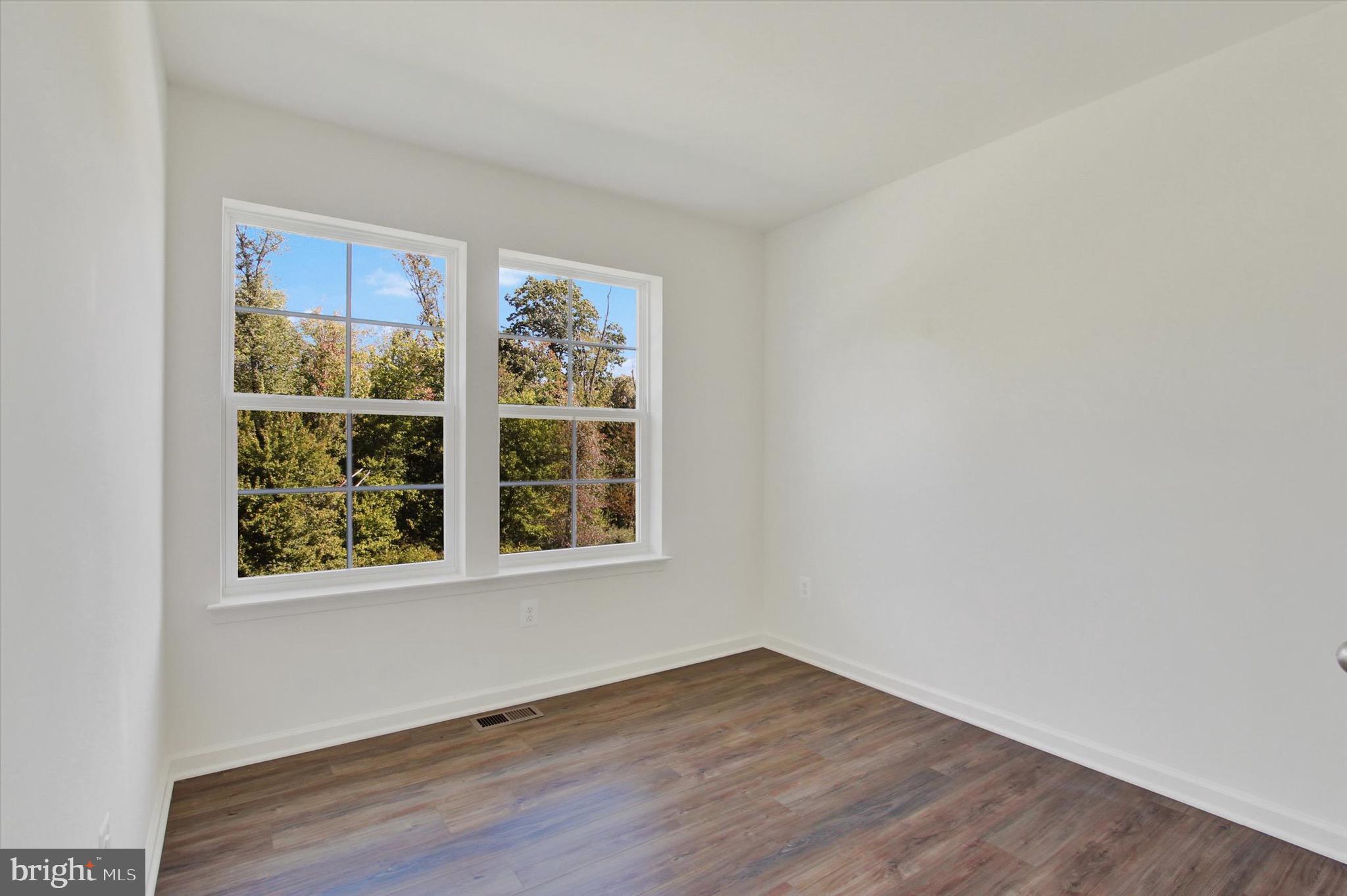 107 Homestead Drive Hanover, PA 17331 - Photo 26 of 34 an empty room with wooden floor and windows