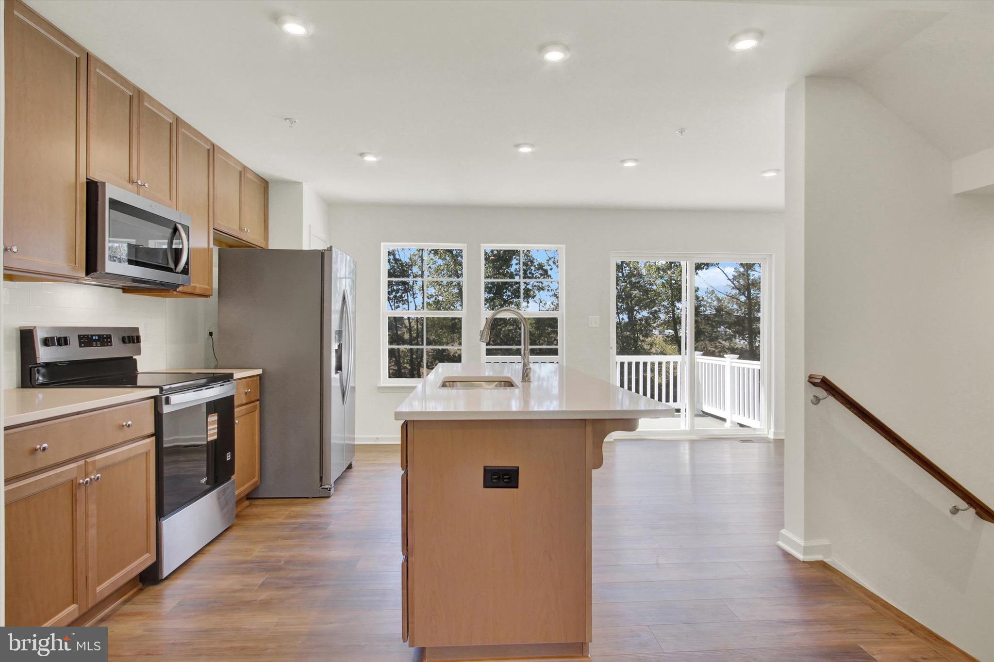 107 Homestead Drive Hanover, PA 17331 - Photo 10 of 34 a kitchen with stainless steel appliances granite countertop a stove and a refrigerator