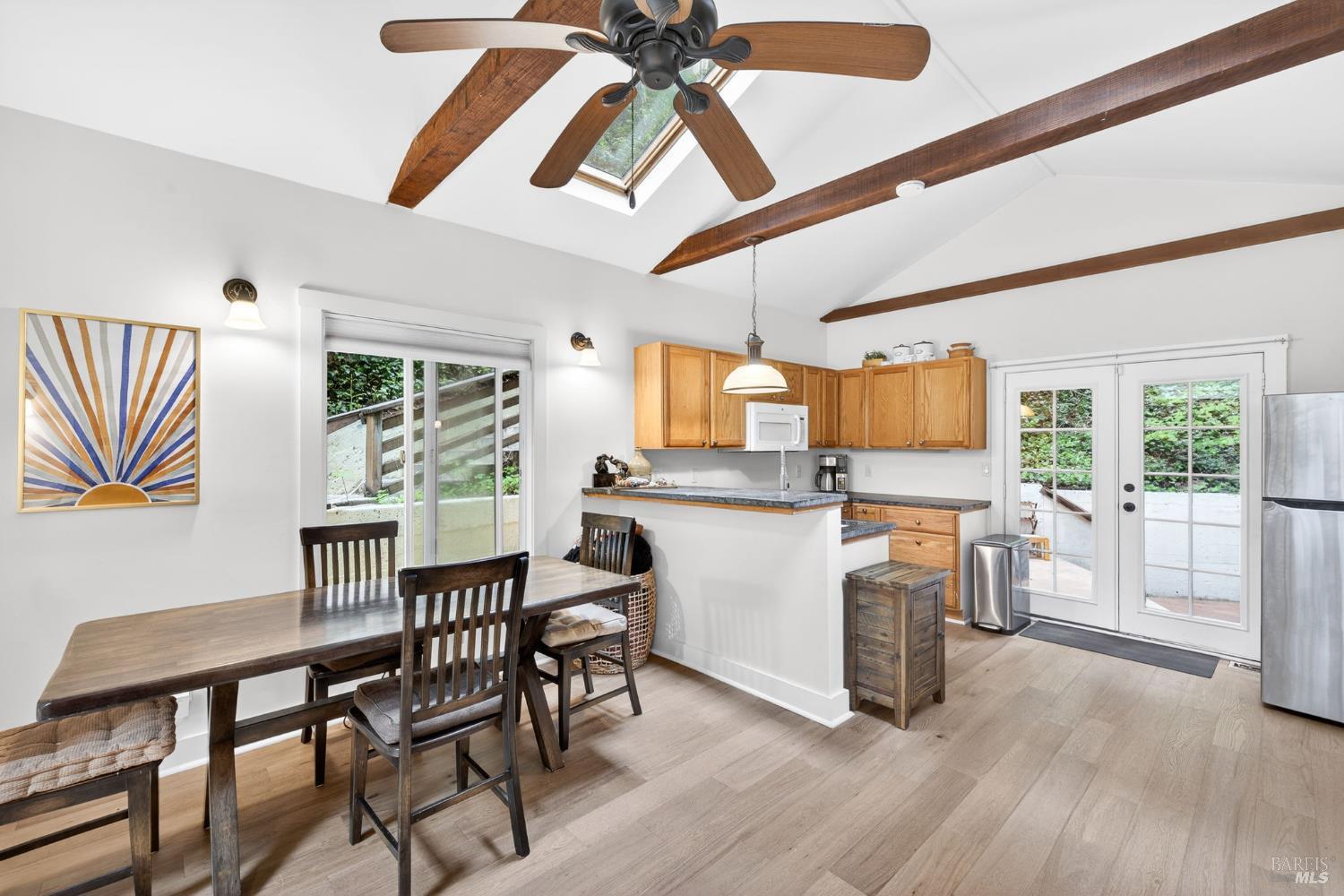 17731 Old Monte Rio Road Guerneville, CA 95446 - Photo 13 of 57 a kitchen with a table chairs refrigerator and cabinets