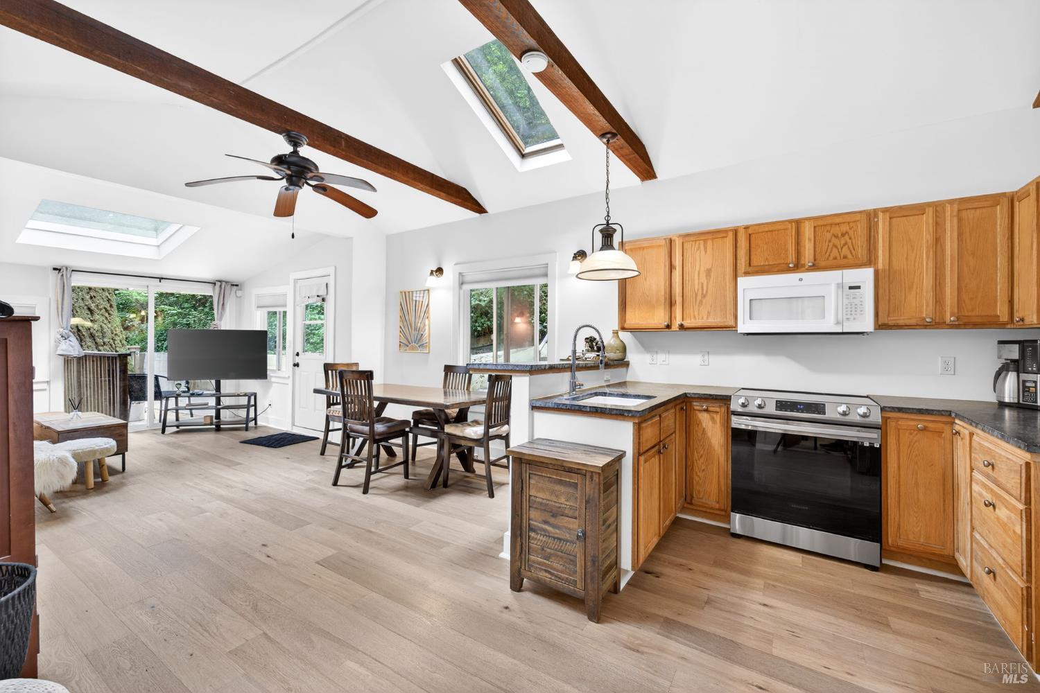 17731 Old Monte Rio Road Guerneville, CA 95446 - Photo 14 of 57 a kitchen with stainless steel appliances granite countertop a stove and a wooden floors