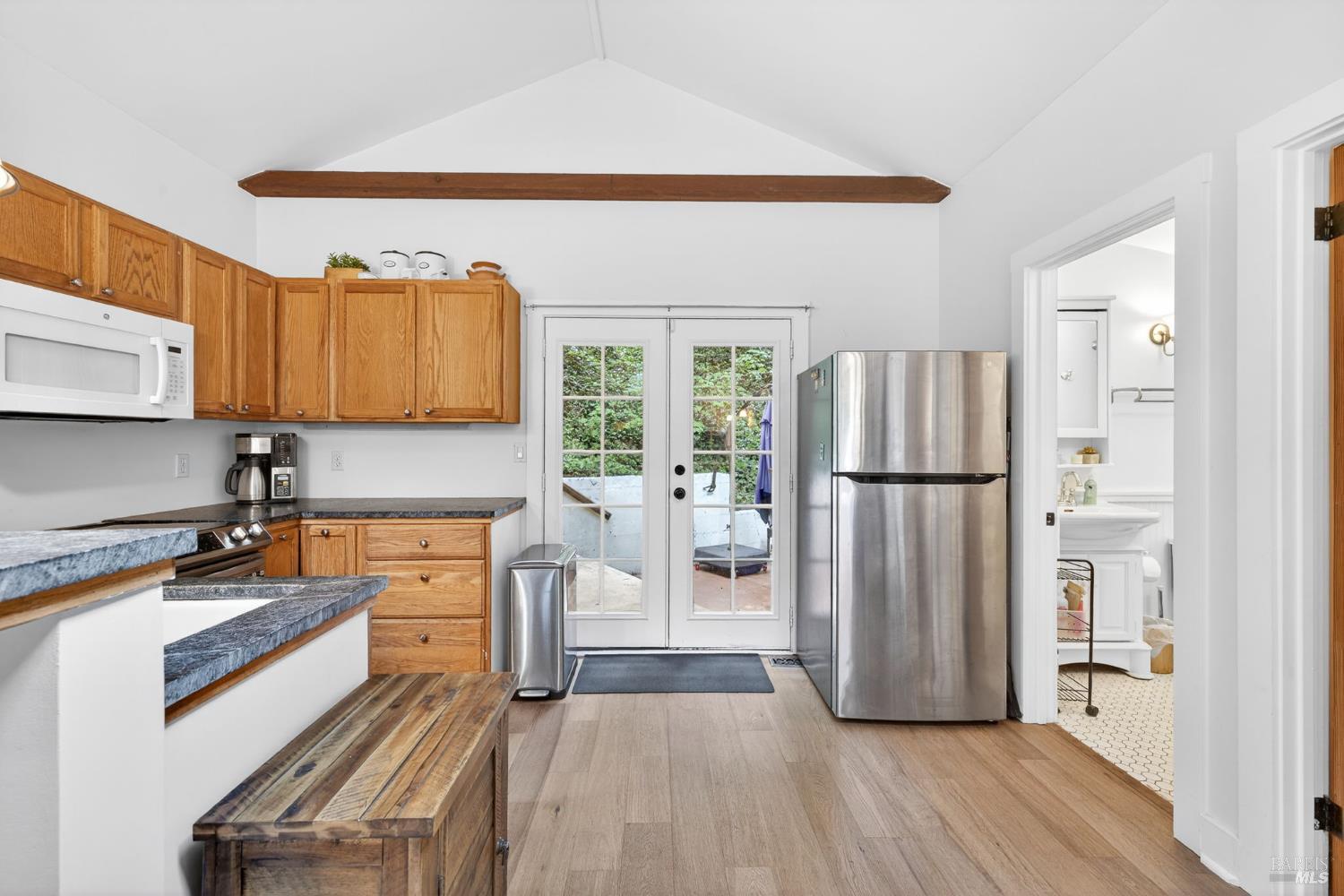 17731 Old Monte Rio Road Guerneville, CA 95446 - Photo 18 of 57 a kitchen with stainless steel appliances granite countertop a refrigerator a stove and a sink