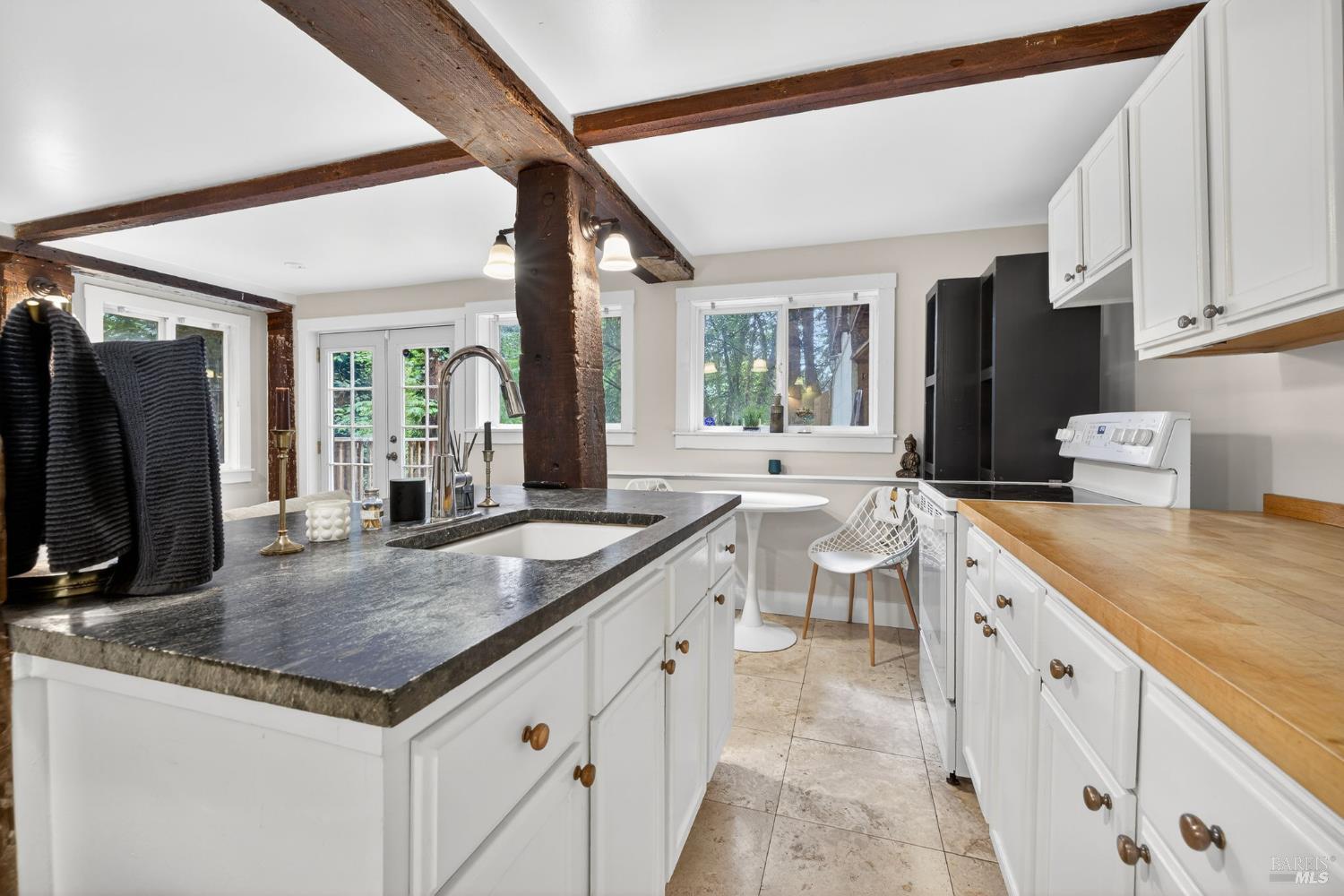 17731 Old Monte Rio Road Guerneville, CA 95446 - Photo 30 of 57 a view of a kitchen with granite countertop a sink and a stove top oven