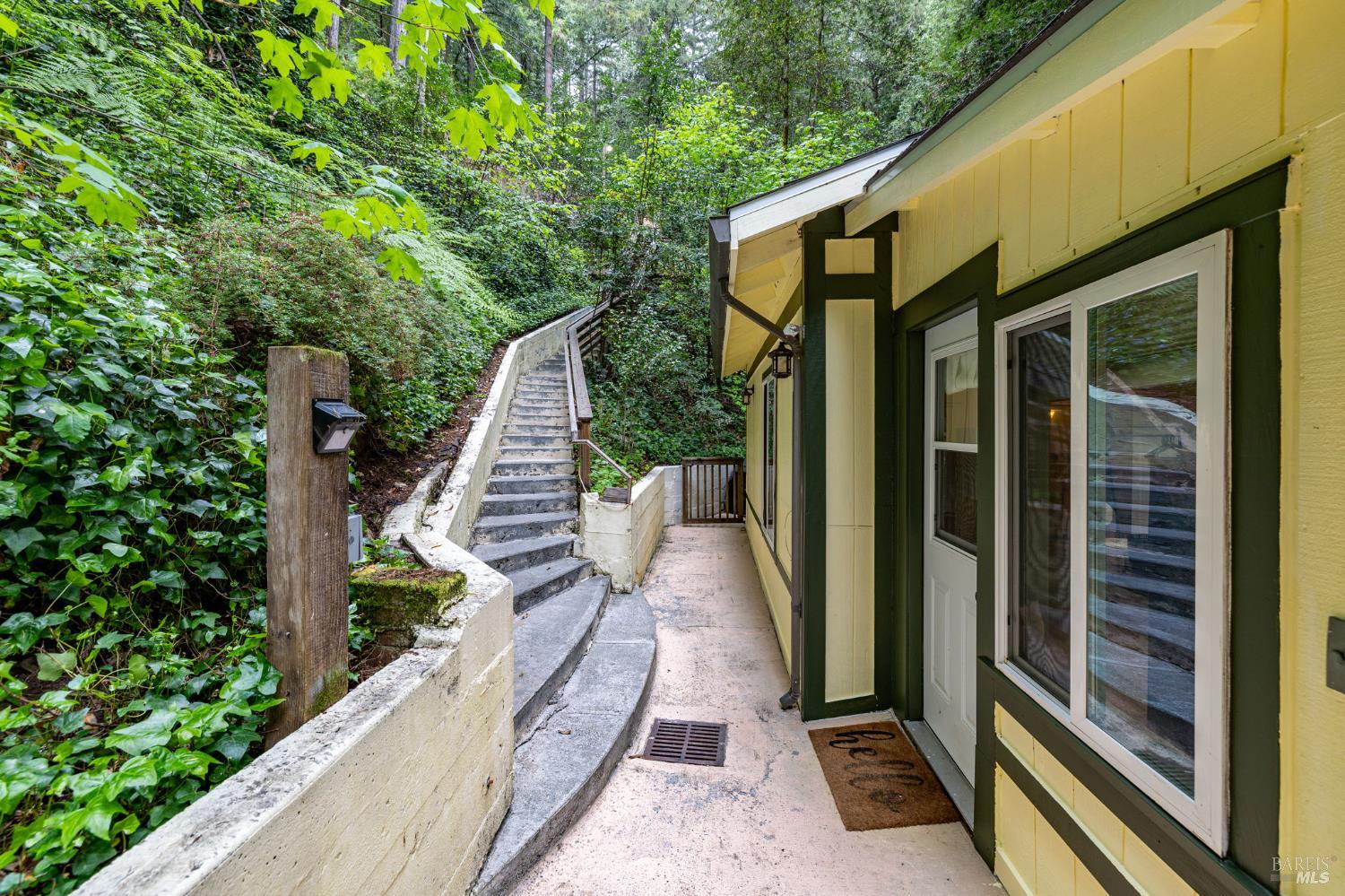 17731 Old Monte Rio Road Guerneville, CA 95446 - Photo 3 of 57 a view of a house with backyard and porch