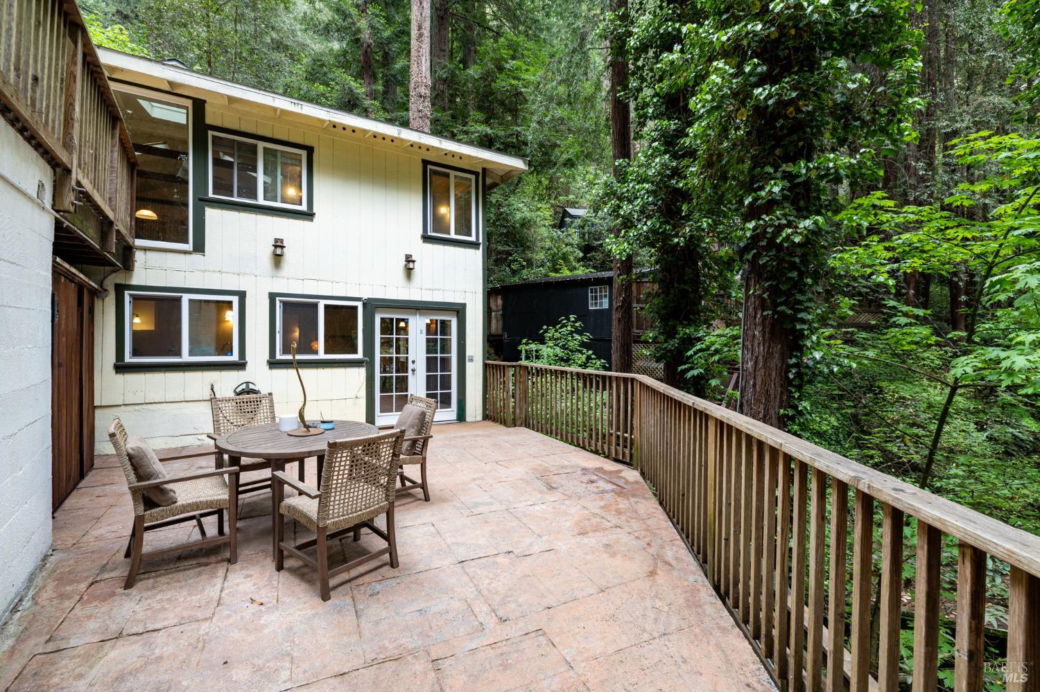 17731 Old Monte Rio Road Guerneville, CA 95446 - Photo 34 of 57 a balcony with table and chairs