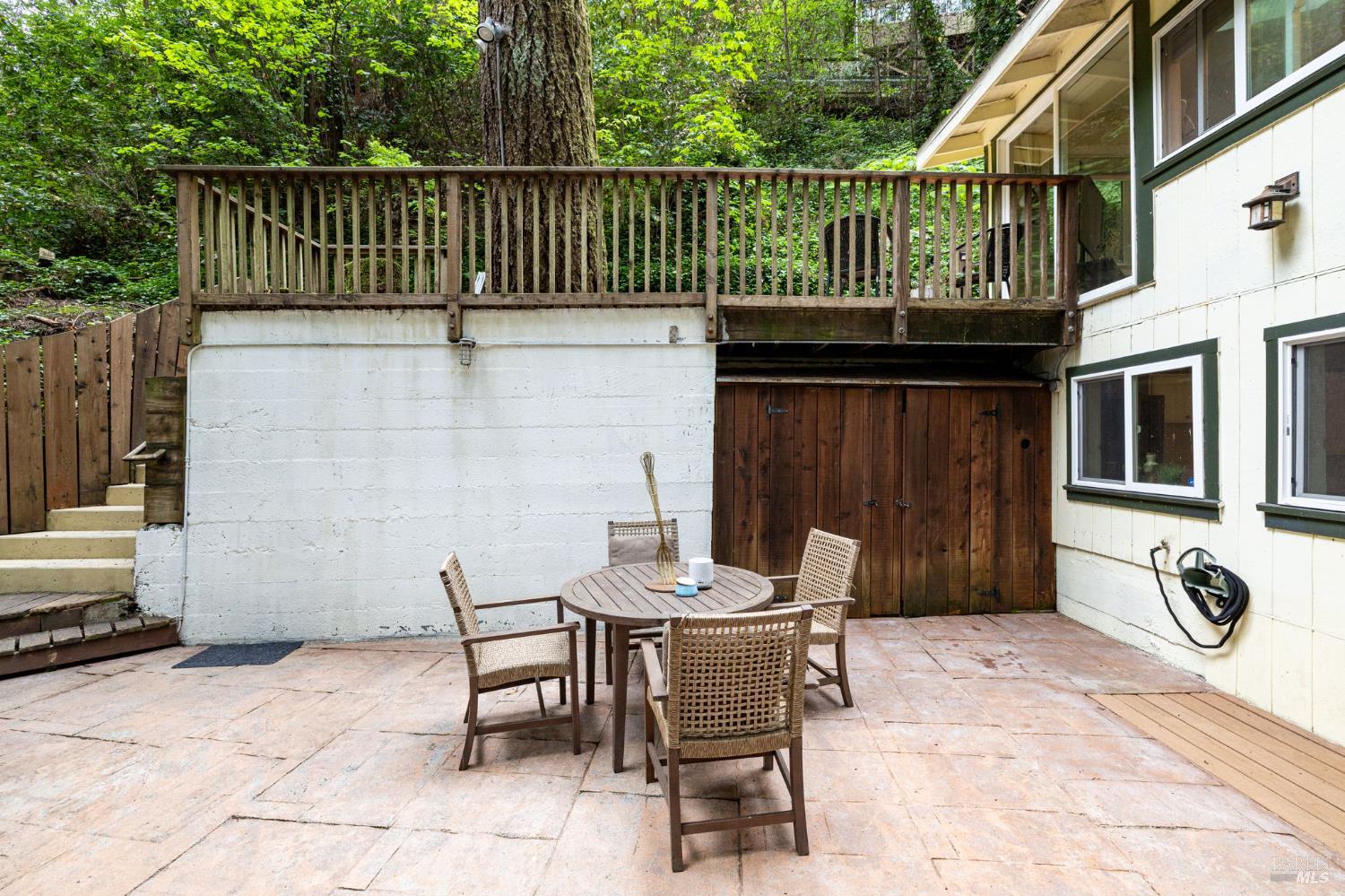 17731 Old Monte Rio Road Guerneville, CA 95446 - Photo 38 of 57 a view of a patio with a table and chairs