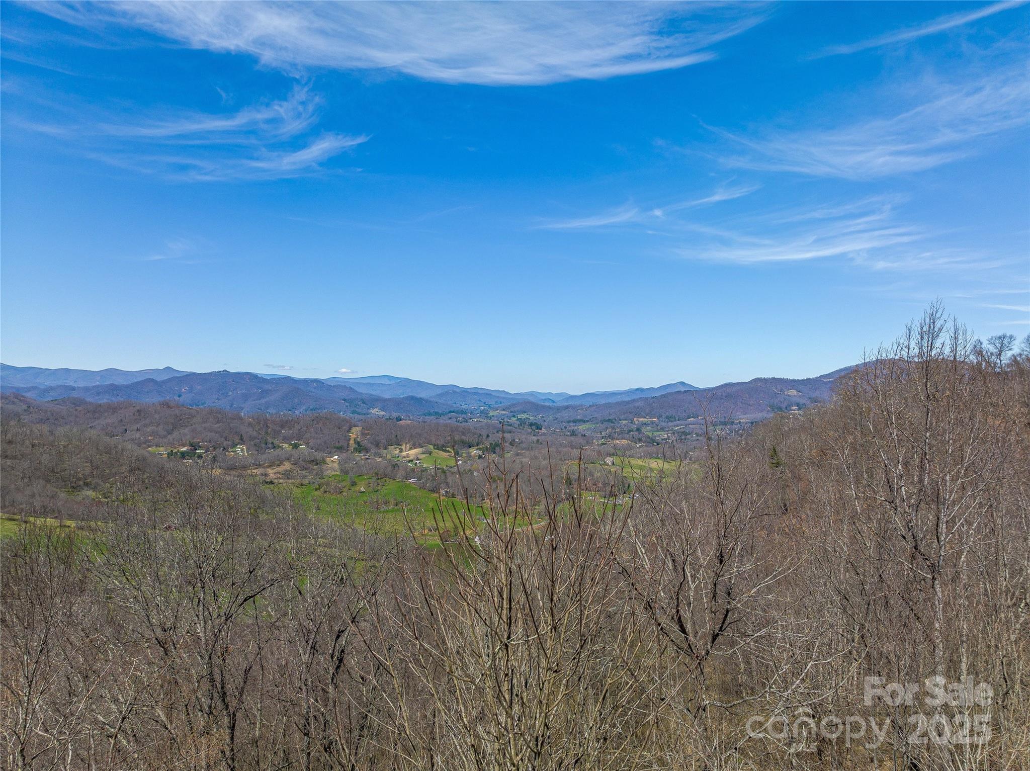 999 Cracker Trail Clyde, NC 28721 - Photo 13 of 23 a view of an mountain with sunset in background