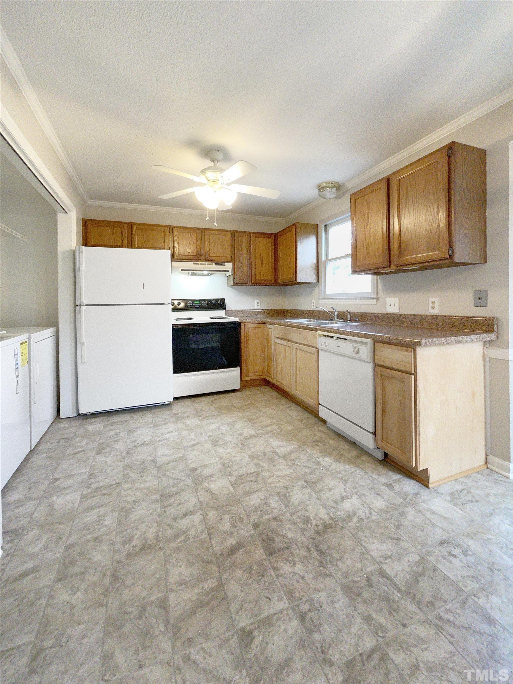 7316 Ewing Place Raleigh, NC 27616 - Photo 13 of 19 a large kitchen with cabinets and stainless steel appliances