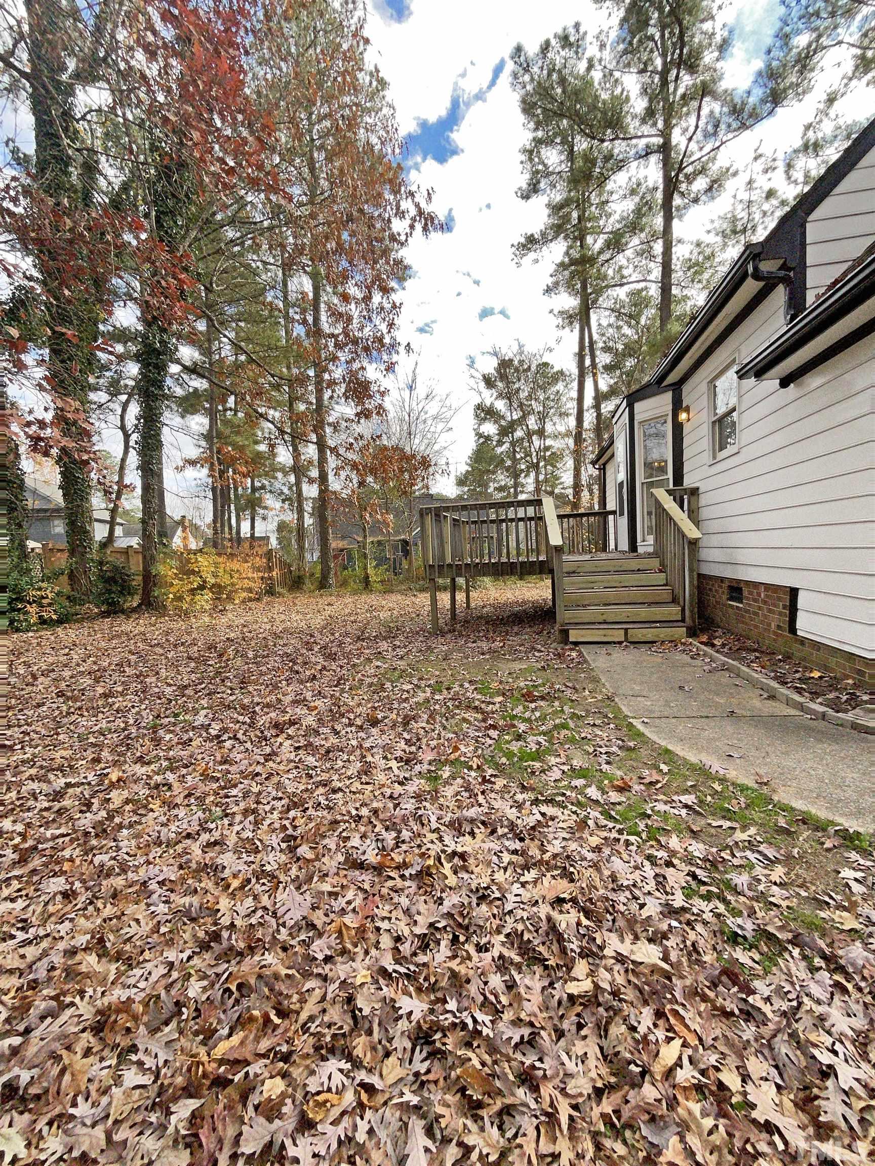 7316 Ewing Place Raleigh, NC 27616 - Photo 18 of 19 a bench is sitting in middle of the yard